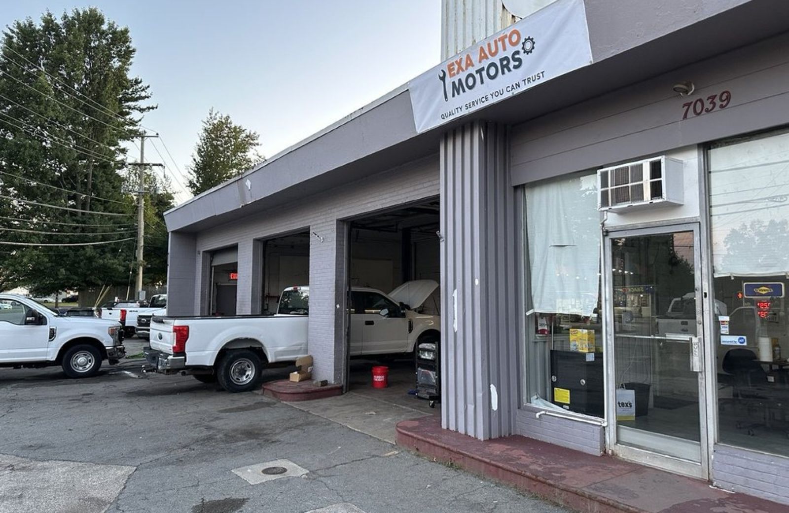 The EXA Auto Motors workshop and entrance at 7039 Mill Creek Rd